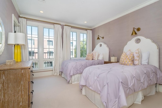 bedroom with ornamental molding and carpet flooring