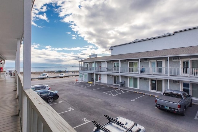 uncovered parking lot with a water view