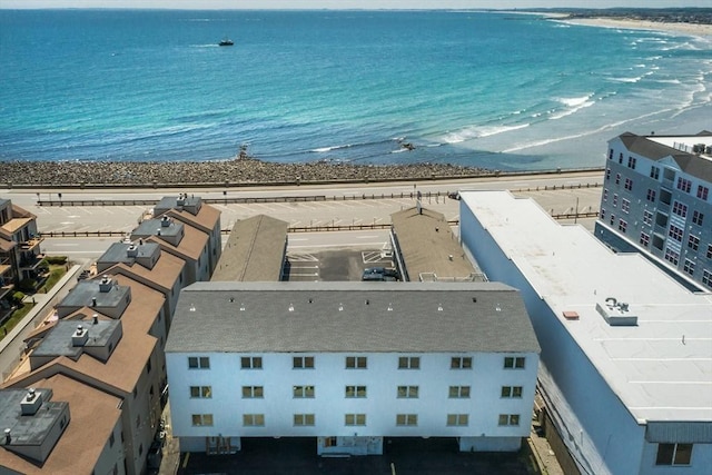 drone / aerial view featuring a water view and a beach view