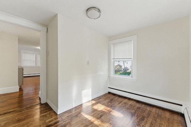 357 Granite St, Quincy, MA 02169 - empty room with a baseboard heating unit, wood-type flooring, and healthy amount of natural light