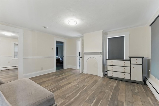 357 Granite St, Quincy, MA 02169 - living room featuring a baseboard radiator and wood finished floors