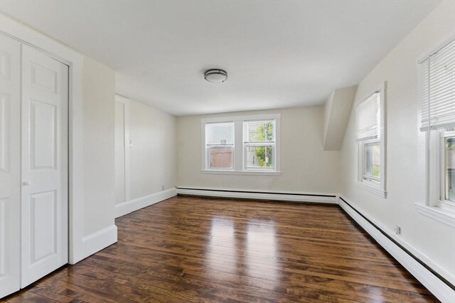 357 Granite St, Quincy, MA 02169 - empty room with a baseboard heating unit, wood finished floors, and baseboard heating