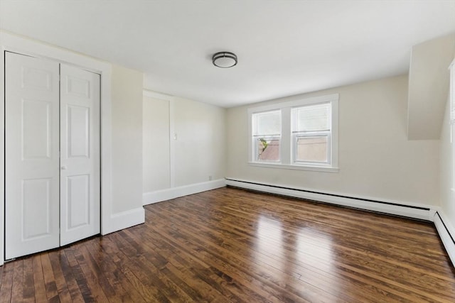 357 Granite St, Quincy, MA 02169 - unfurnished bedroom featuring baseboard heating, hardwood / wood-style floors, and a closet