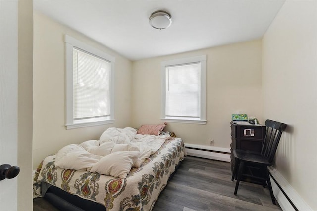 357 Granite St, Quincy, MA 02169 - bedroom featuring baseboard heating, a baseboard heating unit, multiple windows, and dark wood-style flooring