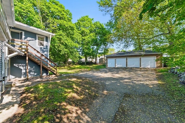 357 Granite St, Quincy, MA 02169 - view of yard with stairway, a detached garage, and an outdoor structure