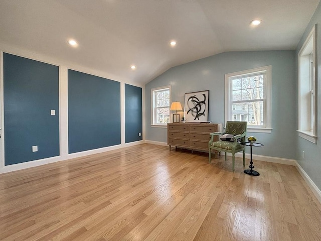 sitting room with lofted ceiling, recessed lighting, baseboards, and light wood finished floors