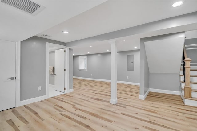 basement with visible vents, light wood-style flooring, recessed lighting, stairway, and baseboards