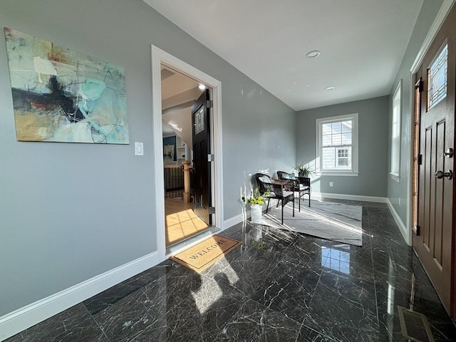 entrance foyer featuring recessed lighting, visible vents, marble finish floor, and baseboards