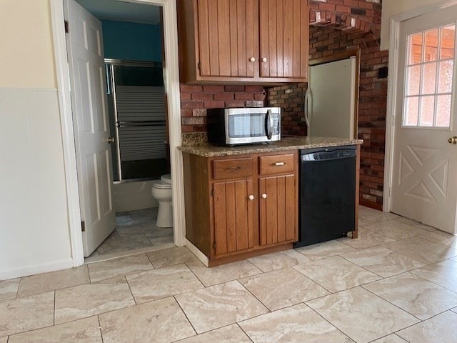 kitchen featuring dishwasher and white refrigerator