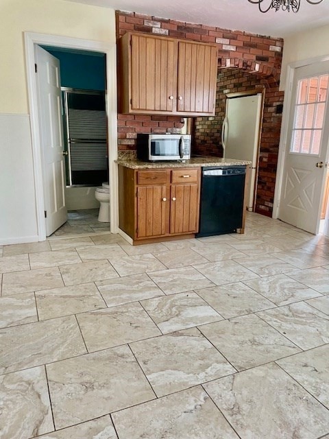 kitchen featuring black dishwasher and decorative backsplash