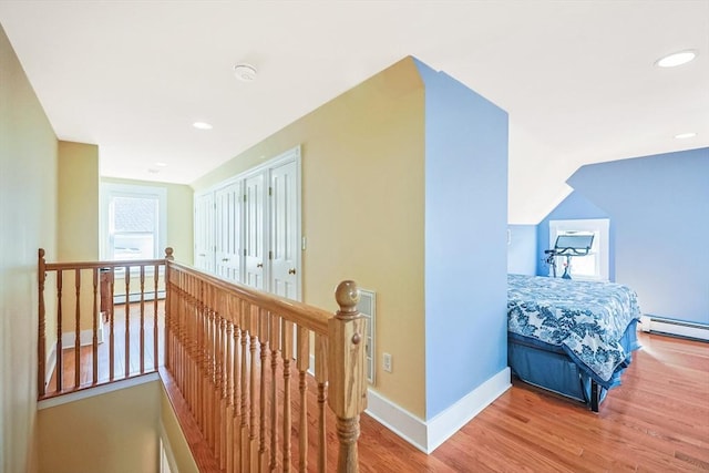 113 Taylor St Unit 1, Waltham, MA 02453 - hall featuring recessed lighting, baseboards, an upstairs landing, and wood finished floors