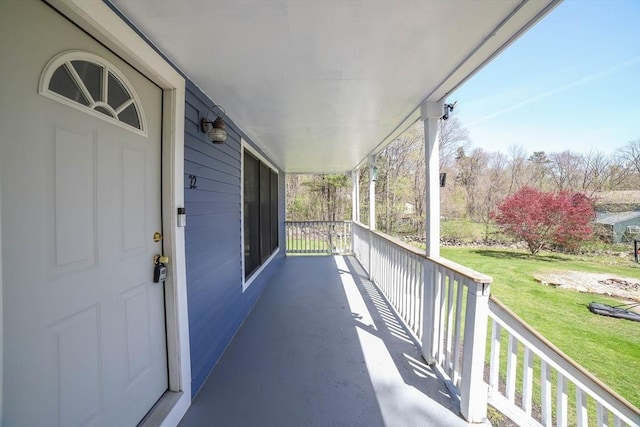 balcony featuring a porch