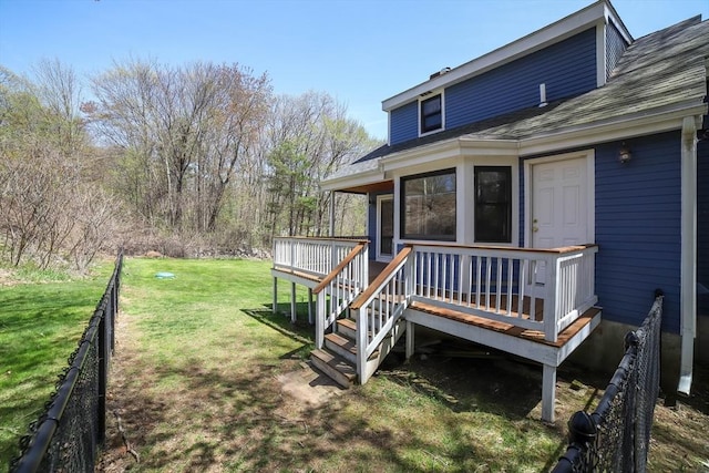 view of yard featuring fence and a wooden deck