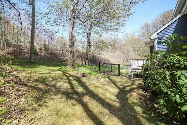 view of yard with fence and a gate