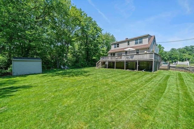 167 Green St, Abington, MA 02351 - view of grassy yard with stairway, a deck, and a storage unit