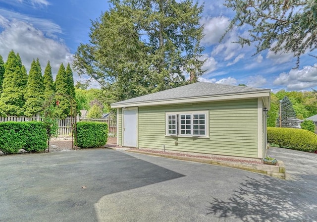 view of side of property with fence and a patio area