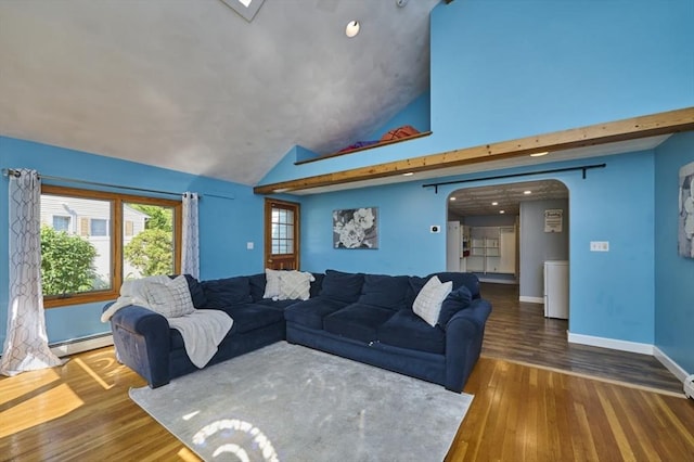 10 Locust St, Burlington, MA 01803 - living room with a baseboard radiator, high vaulted ceiling, wood finished floors, and arched walkways
