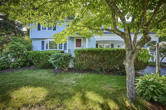 10 Locust St, Burlington, MA 01803 - view of property hidden behind natural elements featuring a front yard
