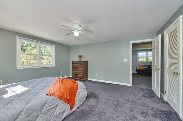 10 Locust St, Burlington, MA 01803 - bedroom featuring dark colored carpet, a ceiling fan, a baseboard heating unit, and a closet