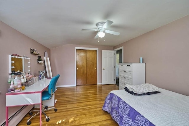 10 Locust St, Burlington, MA 01803 - bedroom with wood finished floors, an office area, baseboard heating, ceiling fan, and lofted ceiling