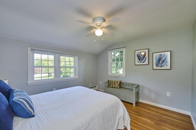 10 Locust St, Burlington, MA 01803 - bedroom with lofted ceiling, wood finished floors, ceiling fan, and a baseboard heating unit