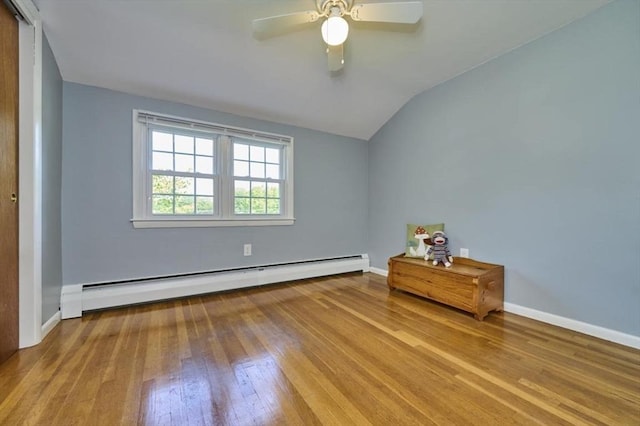 10 Locust St, Burlington, MA 01803 - bedroom with baseboard heating, wood finished floors, vaulted ceiling, and a ceiling fan