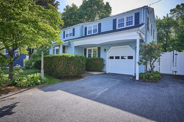 10 Locust St, Burlington, MA 01803 - view of front of home featuring a garage and asphalt driveway