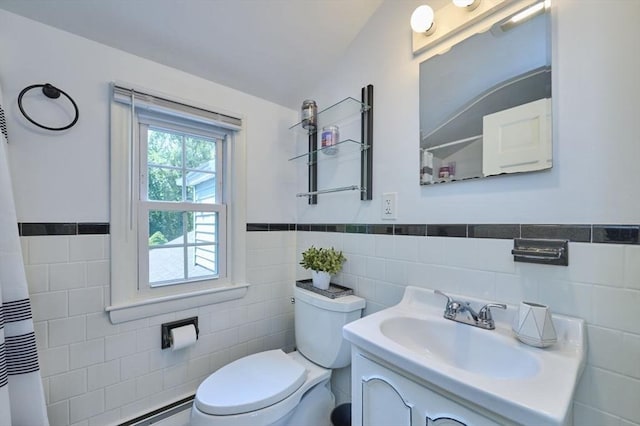 10 Locust St, Burlington, MA 01803 - full bathroom with tile walls, wainscoting, vanity, a shower with shower curtain, and a baseboard heating unit