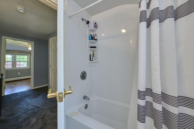 10 Locust St, Burlington, MA 01803 - bathroom featuring baseboard heating and shower / bathtub combination with curtain