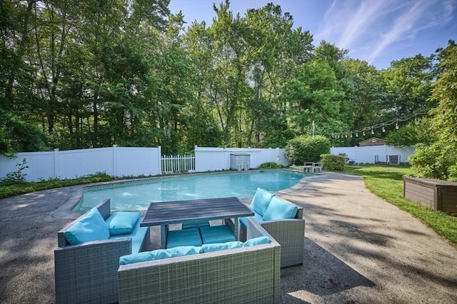10 Locust St, Burlington, MA 01803 - view of swimming pool featuring a fenced backyard, outdoor lounge area, a patio area, and view of scattered trees