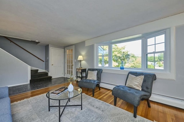 10 Locust St, Burlington, MA 01803 - living room featuring wood finished floors and a baseboard radiator