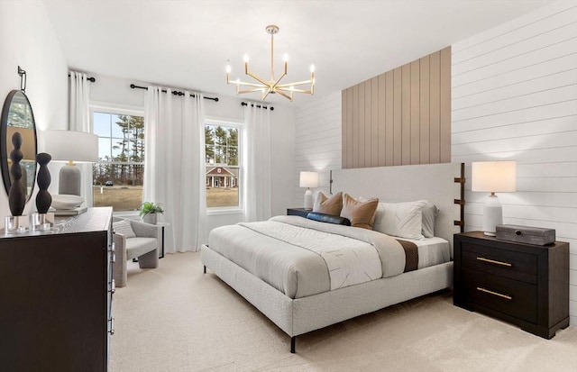 bedroom with an inviting chandelier, light colored carpet, and wooden walls