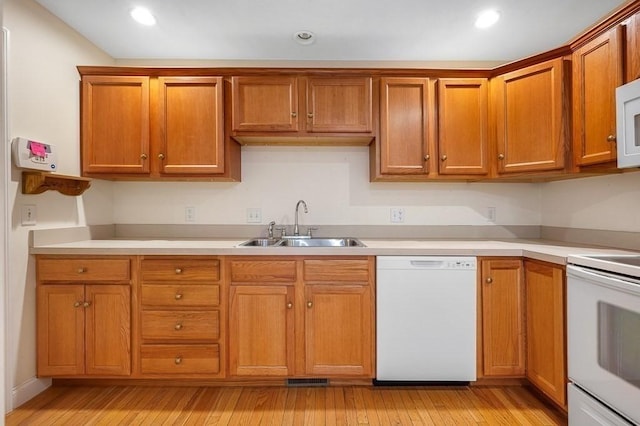 30 Horne Way Unit 30, Millbury, MA 01527 - kitchen featuring white appliances, a sink, light countertops, light wood-style floors, and recessed lighting
