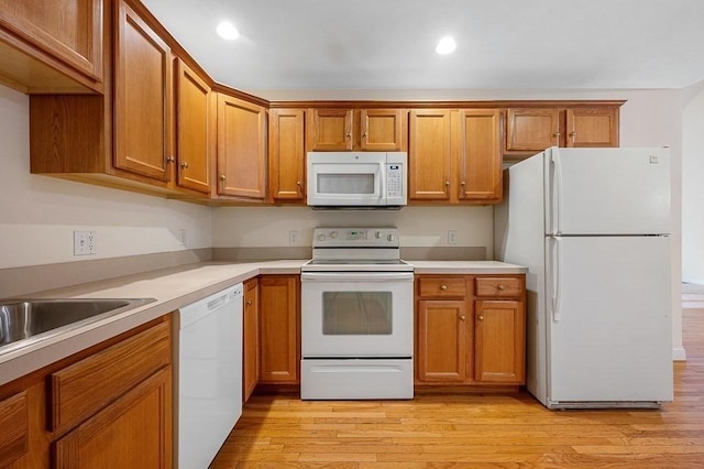 30 Horne Way Unit 30, Millbury, MA 01527 - kitchen featuring white appliances, brown cabinets, light wood finished floors, recessed lighting, and light countertops