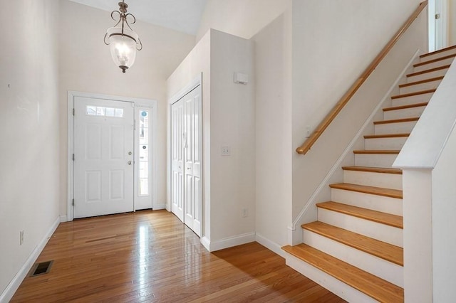 30 Horne Way Unit 30, Millbury, MA 01527 - foyer entrance featuring stairs, wood finished floors, baseboards, and a chandelier