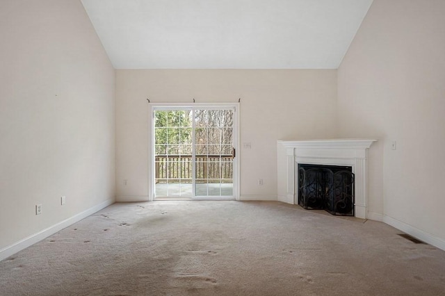 30 Horne Way Unit 30, Millbury, MA 01527 - unfurnished living room featuring lofted ceiling, carpet flooring, a fireplace with flush hearth, and baseboards