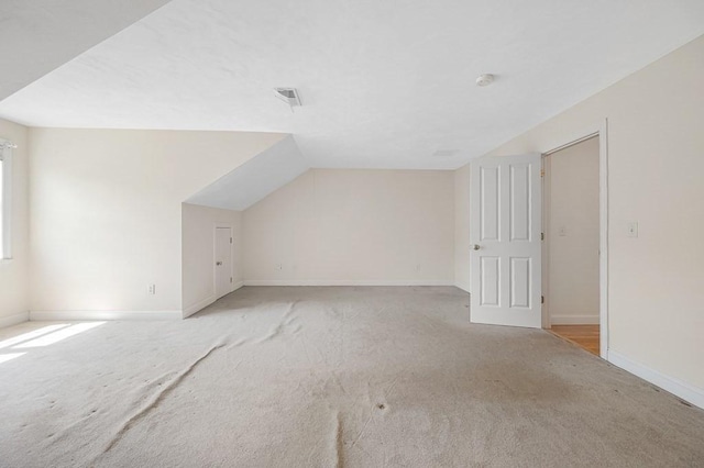 30 Horne Way Unit 30, Millbury, MA 01527 - additional living space with light colored carpet, baseboards, and lofted ceiling