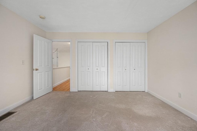 30 Horne Way Unit 30, Millbury, MA 01527 - unfurnished bedroom featuring multiple closets, carpet, and baseboards