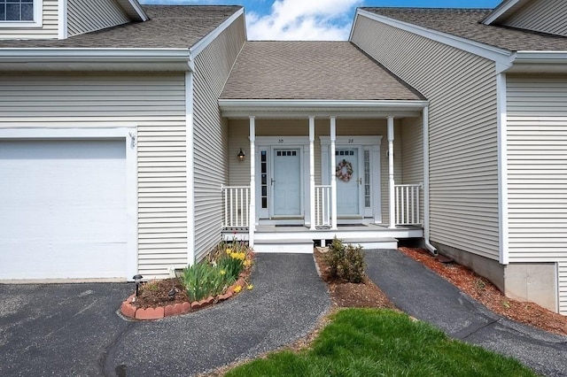 30 Horne Way Unit 30, Millbury, MA 01527 - entrance to property featuring covered porch, roof with shingles, and a garage