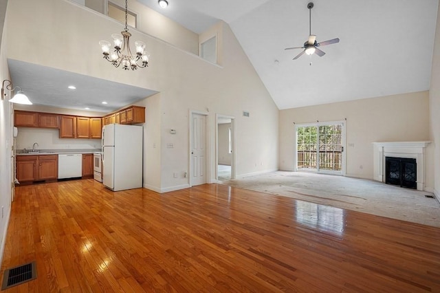 30 Horne Way Unit 30, Millbury, MA 01527 - unfurnished living room with high vaulted ceiling, light wood finished floors, ceiling fan, a chandelier, and a sink