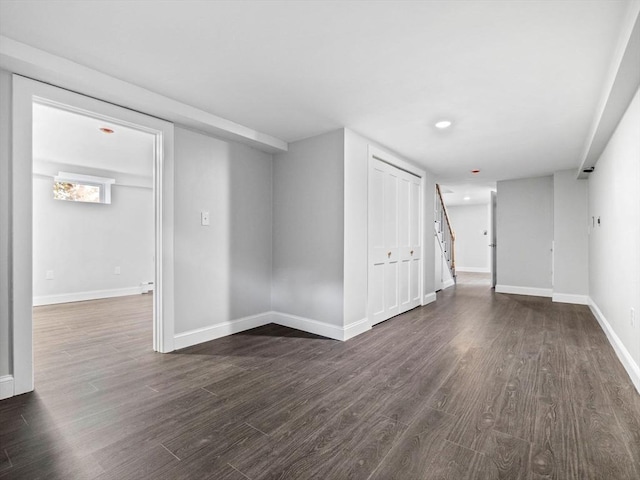 spare room featuring dark wood-type flooring