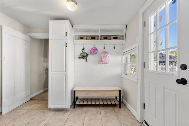 mudroom featuring baseboards and light tile patterned floors