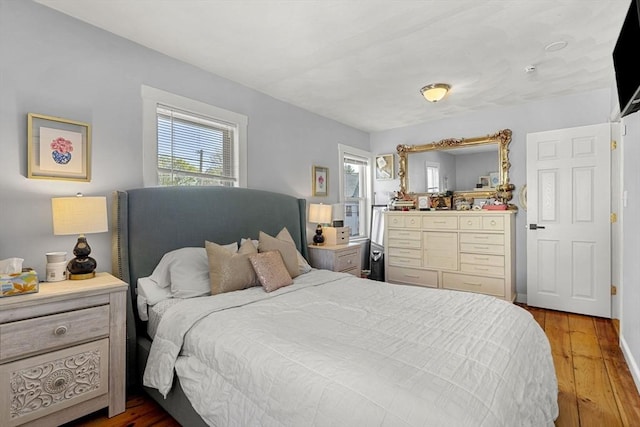 bedroom with wood finished floors