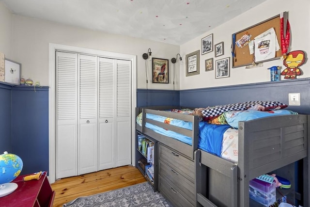 bedroom with a closet and light wood-type flooring