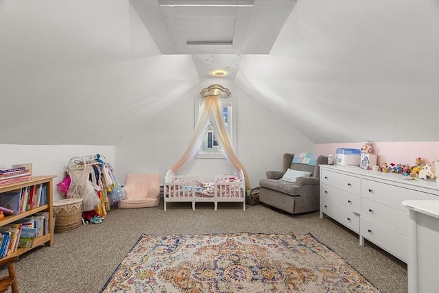 rec room with carpet flooring, vaulted ceiling, and attic access