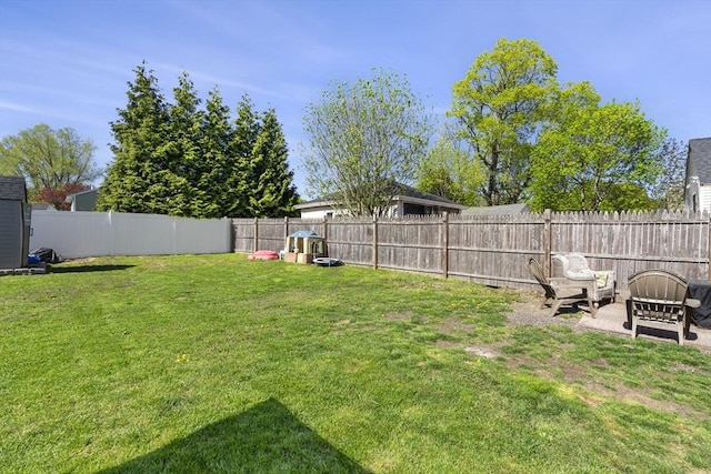 view of yard with a fenced backyard
