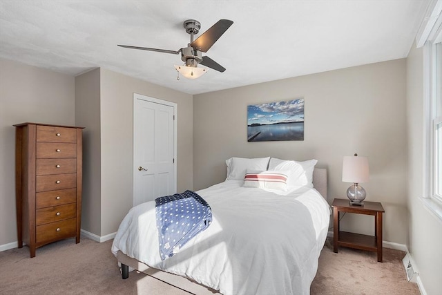 bedroom featuring ceiling fan and light colored carpet