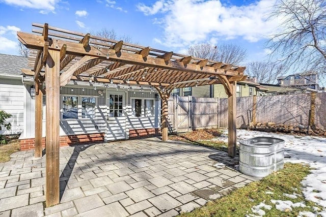 view of patio featuring fence and a pergola