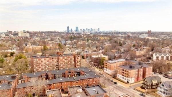 birds eye view of property with a view of city