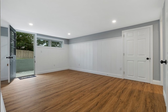 empty room with hardwood / wood-style flooring